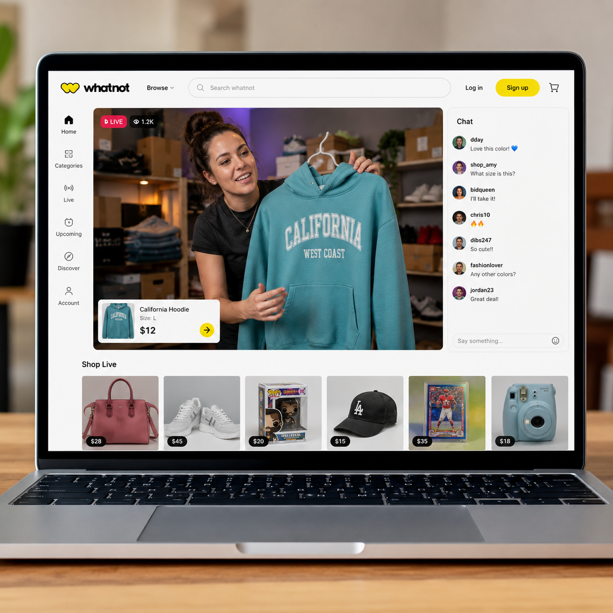 Whatnot live shopping marketplace displayed on a laptop, featuring a seller showcasing clothing during a live sale with real-time chat, auctions, and Buy It Now listings.