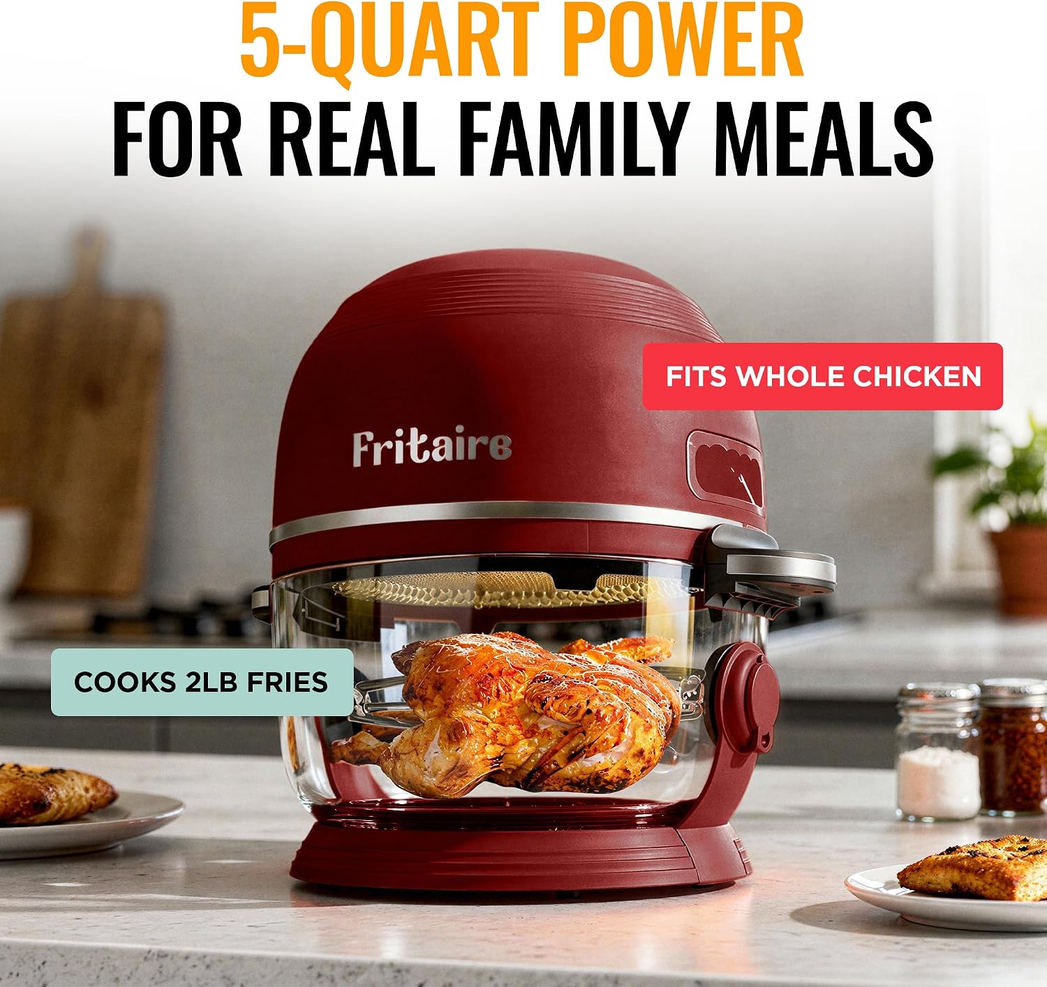 Red 5-quart Fritaire glass air fryer cooking a whole rotisserie chicken, with labels noting it fits a whole chicken and cooks up to 2 pounds of fries.
